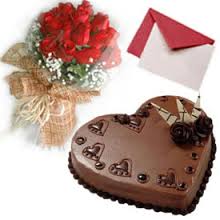 Six red roses with Card and 1 Kg chocolate heart shaped cake