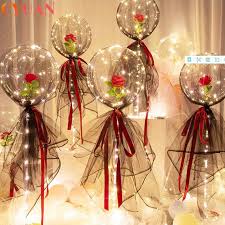 5 Red Rose stuffed in5 transparent balloons with fairy lights decorated with red and white wrapping