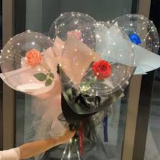 Four Transparent bobo balloons with roses inside and LED Light for anniversary celebration