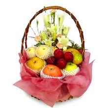 Fresh Fruit and assorted Flowers all in one basket