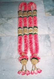 2 garlands with light pink flowers and beads