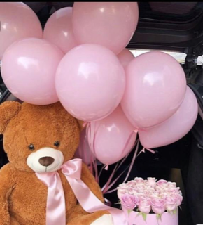 10 Pink gas pre filled balloons tied to the hand of a 12 inched brown Teddy bear with 10 pink roses bouquet