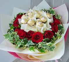 12 red roses and 16 ferrero rocher chocolates in same bouquet