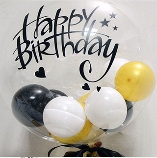 Happy birthday print on the transparent balloon with string lights and 12 flowers in a box
