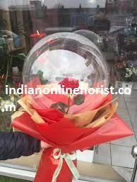 1 transparent balloon 1 red rose arrangement with red wrapping