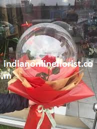 1 transparent balloon 1 red rose arrangement with red wrapping 