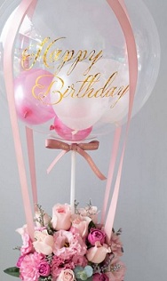 15 white pink flowers roses basket with 3 pink white Balloon in colourless balloon with happy birthday print on balloon