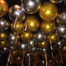 20 Gas filled black gold and silver Balloons tied to ribbons