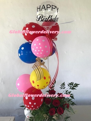 Polka dot balloons arrangement with roses and happy birthday balloon