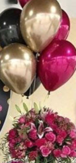 10 Golden Black and Chrome Shiny Pink Balloons inflated with helium gas with a bouquet of 2 Pink Lilies and 20 pink roses