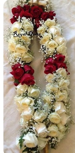 Wedding ceremony marriage traditional jaimala with fresh flowers red white roses for bride and groom