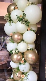 Gold white silver air balloons with flowers in between