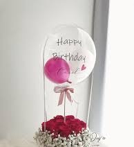 15 Red roses basket with single pink balloon inside a Printed Happy Birthday transparent Balloon