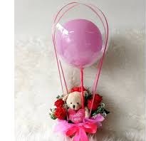 6 Red rose Teddy in basket with single pink balloon inside a transparent Balloon