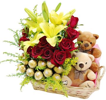 16 ferrero 6 red roses 2 yellow lilies surrounded by 2 Teddies 6 inches each in a basket